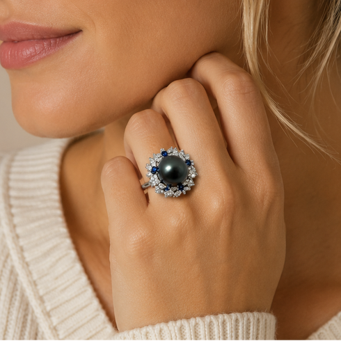 Ring: 11-12mm Tahitian Pearl Sapphire Halo with blue sapphires in a silver setting