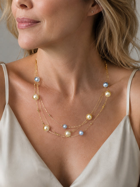 3-Layer Seawater Pearl & Golden South Sea Pearl Necklace with blue and champagne pearls on gold chains.