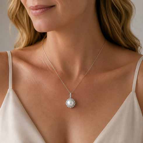 Pendant necklace by House Of Pearls with a white South Sea pearl haloed by cubic zirconia on a delicate silver chain.