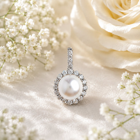 Pendant by House Of Pearls: White South Sea pearl surrounded by cubic zirconia in a silver setting.