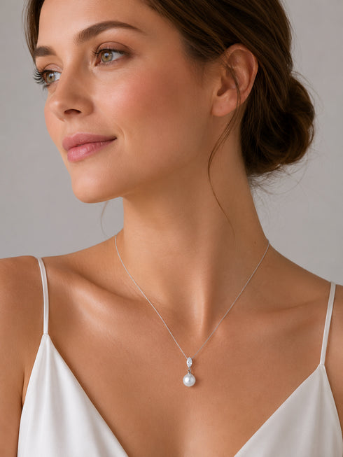 Pendant: White South Sea Pearl Waterdrop with cubic zirconia on a silver chain by House Of Pearls.