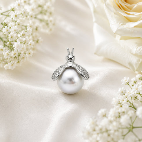 Pendant: White South Sea Pearl Bee by House Of Pearls, last piece, silver setting with diamond-studded wings.