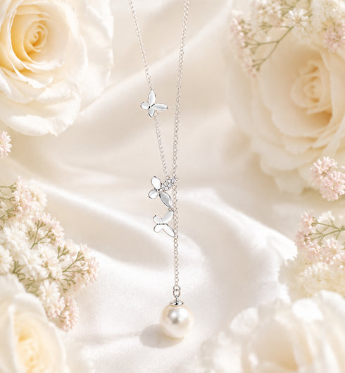 White South Sea Pearl Butterfly Necklace pendant by House Of Pearls with pearl drop and butterfly charms on silver chain