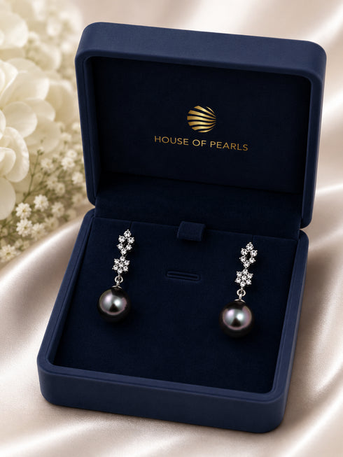 Earrings: 10–11mm Tahitian Pearl Stellar Night Drop pair by House Of Pearls in a navy jewelry box