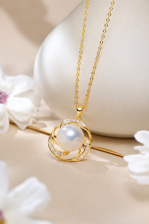 Edison Pearl Spiral Halo Pendant Necklace in gold with a white pearl and crystal-embellished interlocking rings