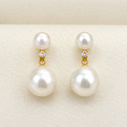 Earrings: 9–10mm freshwater pearl dual-drop pair in gold setting with crystal accents