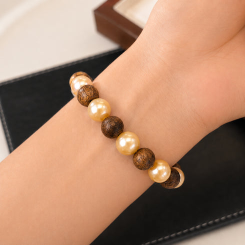 Agarwood & Golden South Sea Pearl Stretch Bracelet with alternating cream pearls and brown beads