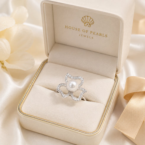 Aurora White Freshwater Pearl Floral Ring by House Of Pearls in a beige jewelry box, sparkling pave diamond accents.