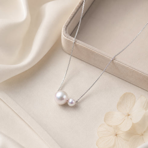Dual freshwater pearl pendant necklace on a silver chain; two pearls (white and pink) by House Of Pearls - TA