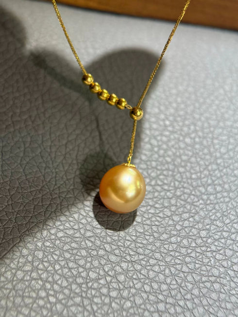 10-11mm Golden South Sea Pearl Y necklace with a large drop pearl and gold bead accents