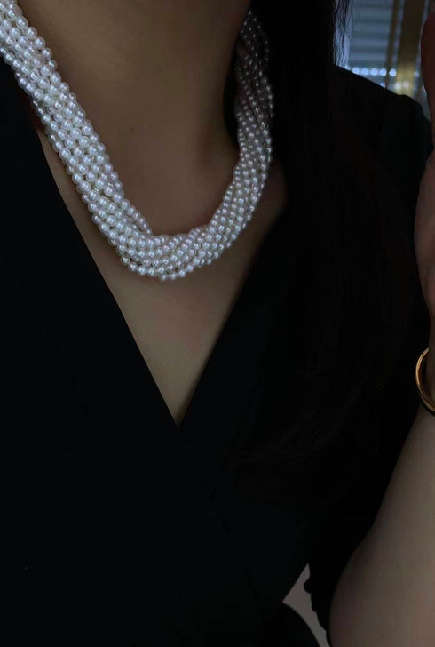 10-Strand Aurora Baby Pearl Necklace with lustrous white pearls in a multi-strand design.