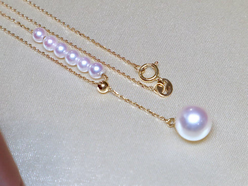 Pearl pendant necklace with four 5–6mm white Japanese Akoya pearls on an 18K gold chain