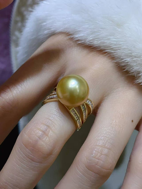 Rings set: three-piece gold stack with a 12–13mm golden South Sea pearl and diamond-accent bands.