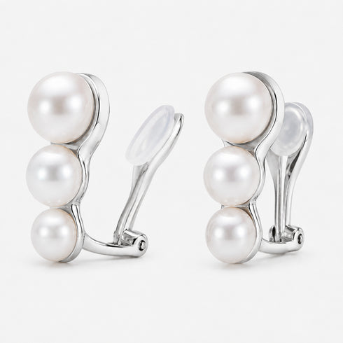 Graduated freshwater pearl trio clip-on earrings; pair featuring three white pearls in silver-tone setting