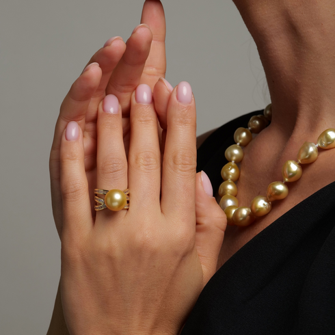 Ring with a 12–13mm golden South Sea pearl on a minimalist gold band