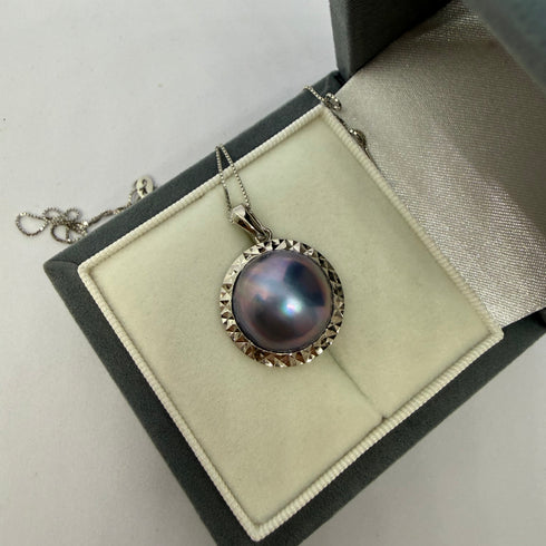 Blue Mabe Pearl Pendant Necklace by House of Pearls in a silver bezel, displayed in a jewelry box