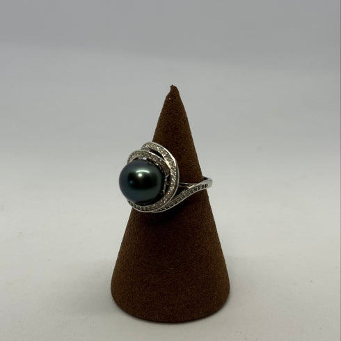11-12mm Tahitian Pearl Ocean Swirl Ring with dark pearl and pavé diamond swirl on display cone