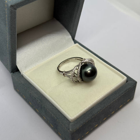 11-12mm Tahitian Pearl Ocean Weave Ring in silver with diamond-accented weave, displayed in a jewelry box
