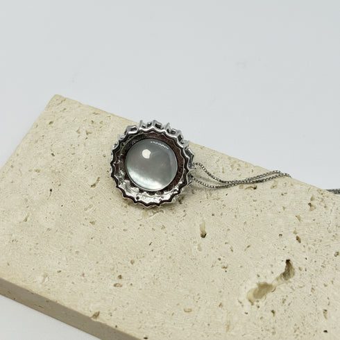 Blue Mabe Pearl Halo Pendant Necklace by House of Pearls on silver chain.