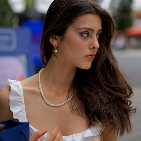 9-10mm freshwater pearl twisted hoop earrings, gold-tone hoops with pearl drop.