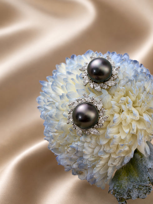 Earrings: pair of 9-10mm Golden South Sea pearl sunburst studs with diamond halo by House Of Pearls.