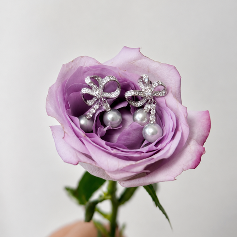 Pair of House Of Pearls earrings: silver celestial bow with blue Japanese Akoya pearl drops, 7-8mm