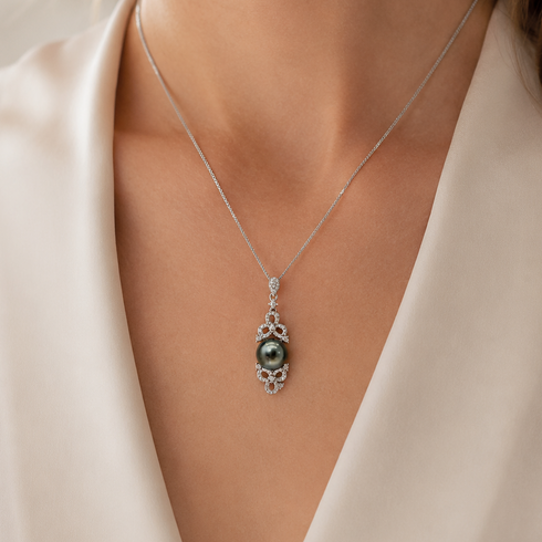 Floral Baroque Tahitian Pearl Pendant Necklace on a silver chain; ornate pendant with a dark pearl.