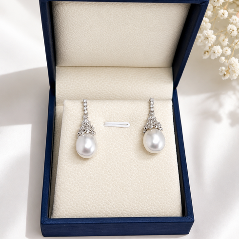 Earrings: 10–11mm Australian White South Sea oval pearl Regal Crown earrings, diamond-accent crown, House Of Pearls XM
