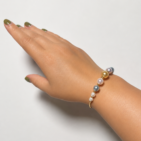 Bracelet by House Of Pearls: Smile Golden South Sea & Akoya pearls on a slim gold band.