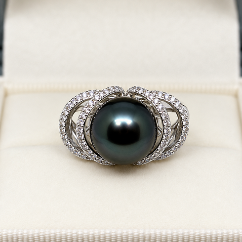 Ring with 11–12mm Tahitian pearl and diamond-encrusted Ocean Weave band in silver metal.