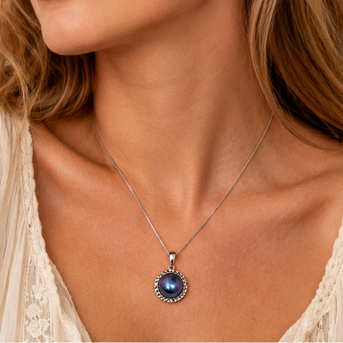 Blue Mother-of-Pearl Statement Pendant Necklace on a silver chain.