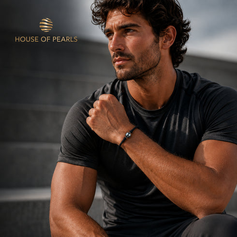 Bracelet: 11–12mm Tahitian Baroque Pearl Band by House Of Pearls - FT; black cord with two grey pearls.