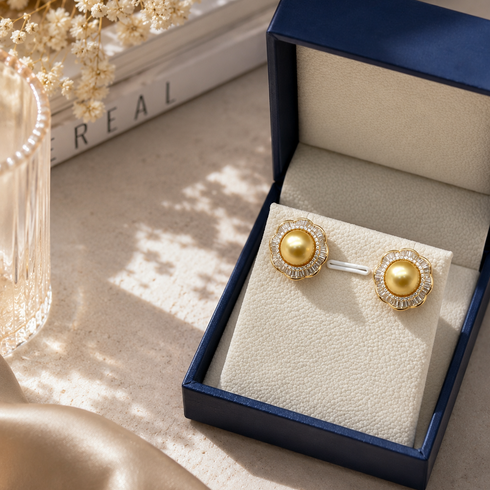 Earrings: 9-10mm Golden South Sea Pearl Floral Halo by House Of Pearls, gold with diamond halo, in navy box.