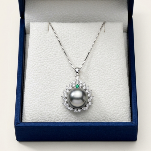 Necklace pendant with an 11–12mm Tahitian pearl, CZ-studded leaf halo and emerald accent in sterling silver