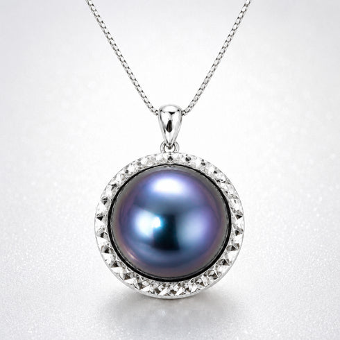 14-15mm blue mabe pearl pendant necklace with a faceted silver halo on a silver chain
