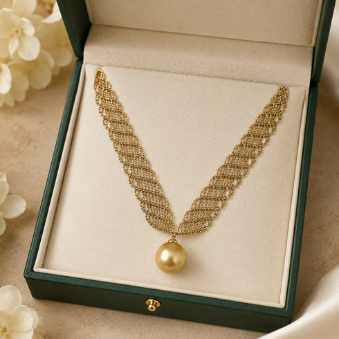 Necklace with a 13-14mm South Sea golden pearl pendant on a gold-tone lace chain.