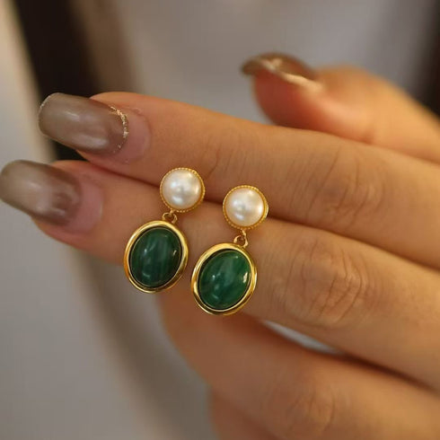 Oval malachite bezel pearl drop earrings, a pair with gold-tone settings, white pearls and green malachite drops