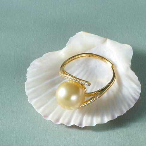 Ring, gold minimalist open design with 10–11mm Golden South Sea pearl and pavé diamonds