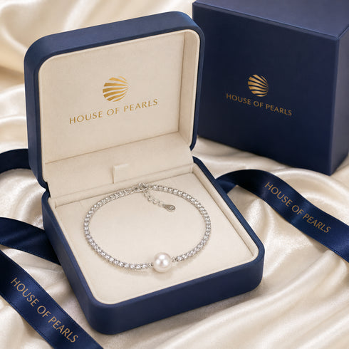 Bracelet: Aurora White Freshwater Pearl Tennis Bracelet by House Of Pearls, silver-tone with pearl centerpiece