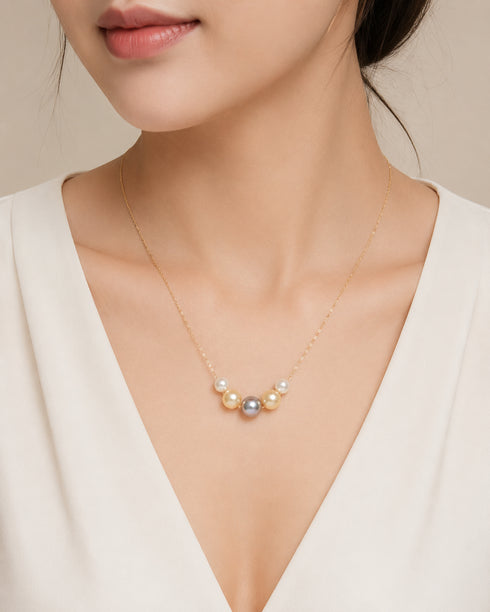 Smile Multicolor Seawater Pearl Necklace on a delicate 18K gold chain.