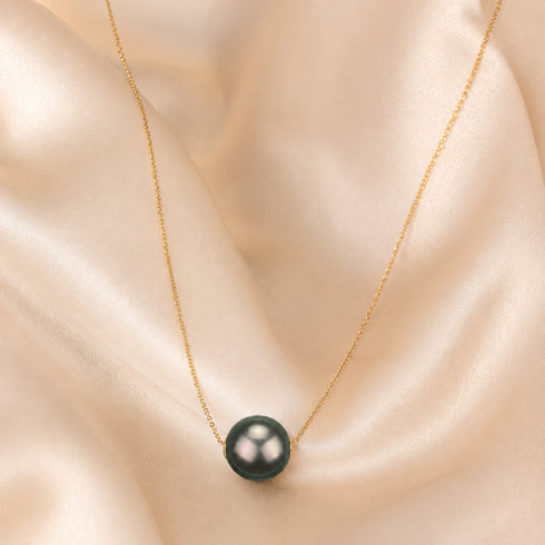 Tahitian Pearl Floating Pendant Necklace on gold chain with a dark green pearl