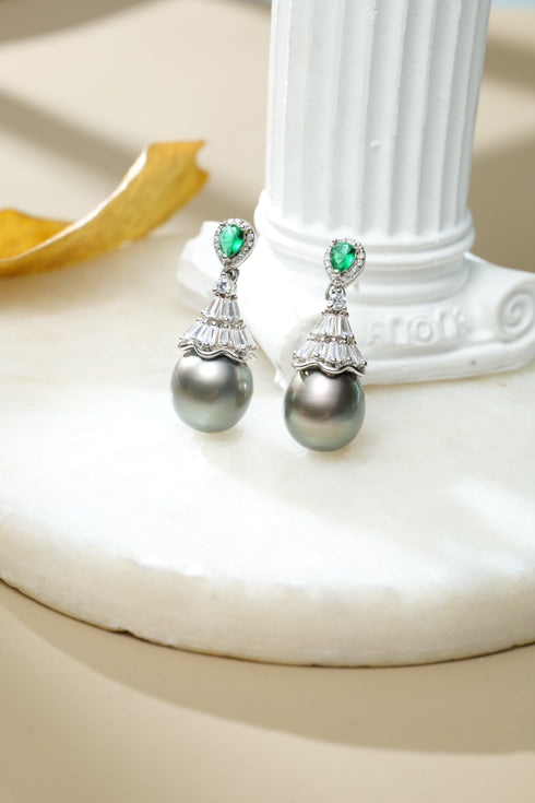 Tahitian Pearl Stellar Drop Earrings by House Of Pearls; silver chandelier tops with emerald-green stones and dark grey pearls