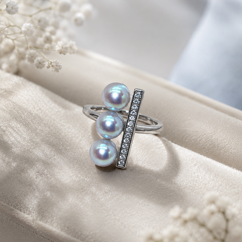 Open ring with three 6–7mm silver-blue Japanese Akoya pearls and a CZ-lined vertical bar.