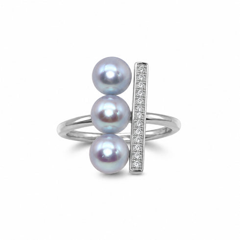 Ring with three silver-blue Akoya pearls beside a CZ bar on an open silver band