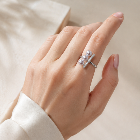 Ring by House Of Pearls: open silver band with three silver-blue Akoya pearls and a CZ pavé bar