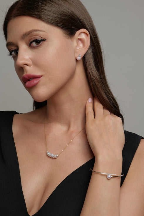 Necklace with five 7–9mm Akoya pearls and cubic zirconia accents on an 18K gold chain.