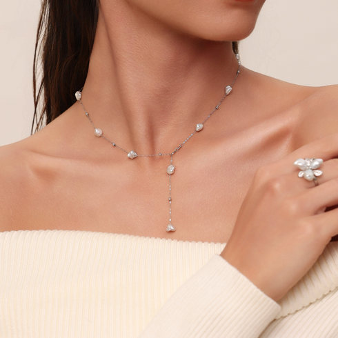 Baroque freshwater pearl Y-shaped necklace on a silver chain with irregular pearls.