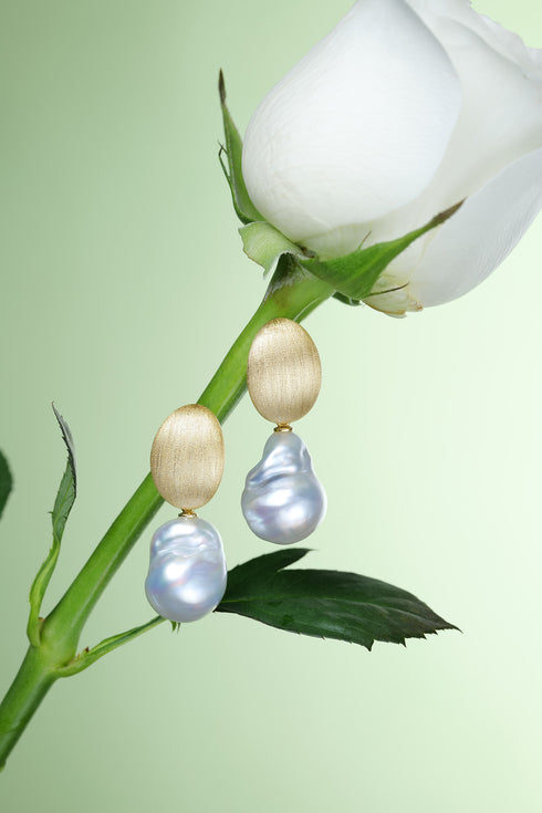 Pair of earrings: 13–14mm white South Sea baroque pearls with brushed gold oval drops.