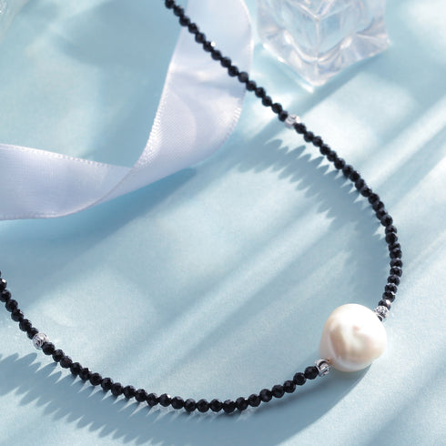 Black spinel beaded baroque pearl choker necklace with a large white pearl pendant