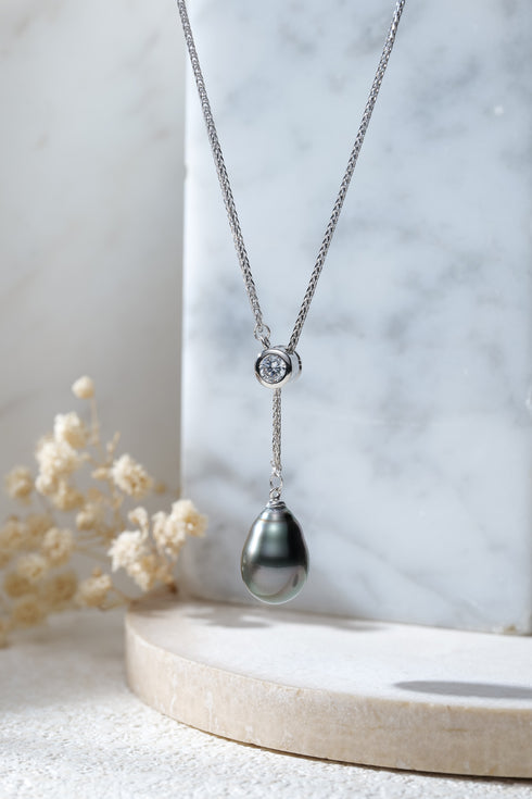 Tahitian black pearl pendant necklace with a diamond accent on a silver chain